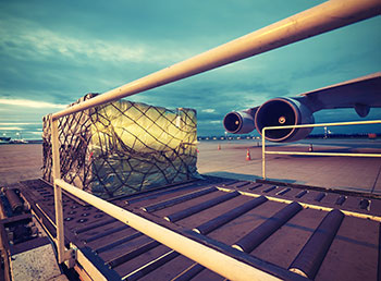 Packages being loaded onto an aeroplane